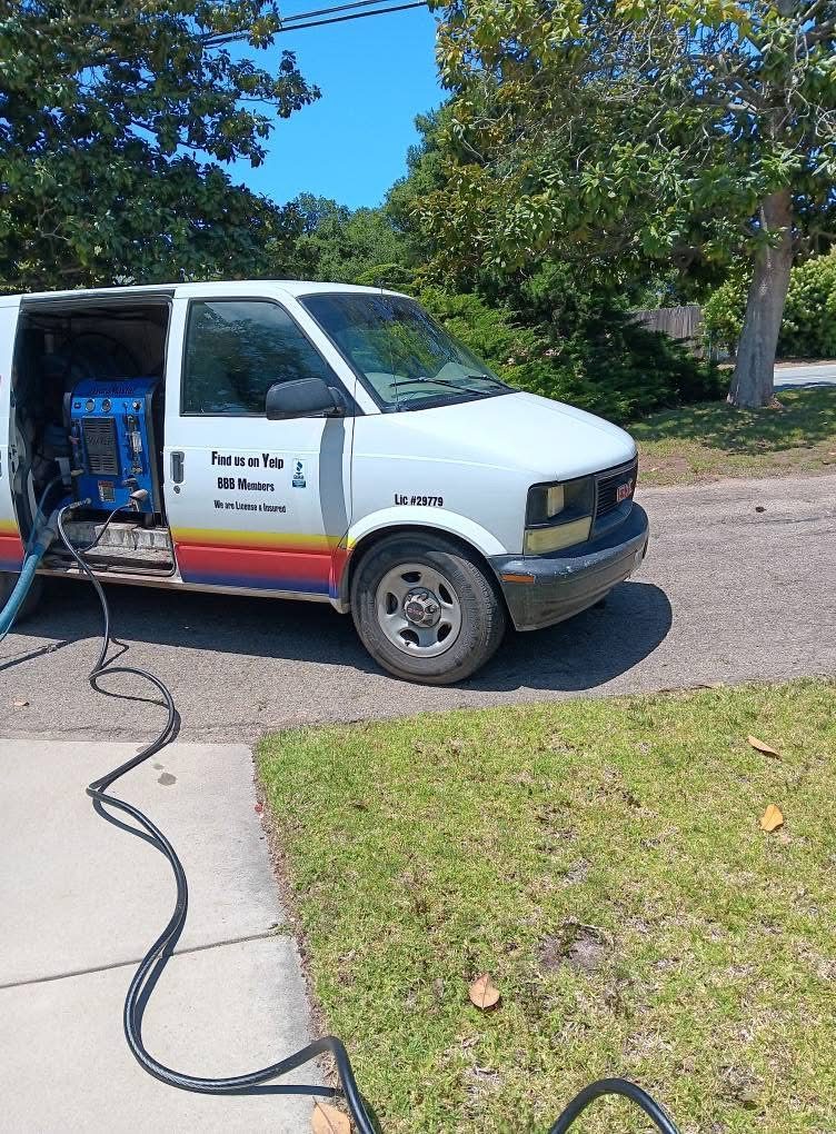 Nava's van with the truck-mounted carpet cleaning unit running at a customer's house
